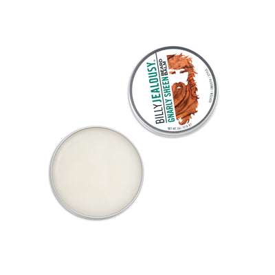 (Product image): open 2oz aluminum tin of Gnarly Sheen beard balm. Product inside is white and waxy.