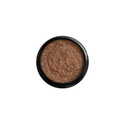 (Product image): Open 1.7oz jar of Assassin deep exfoliating scrub. Product inside is brown with a sandy texture.